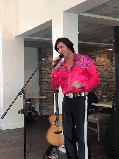 A performer entertaining residents in a bright common area
