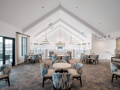 Bright common area with modern seating and decor