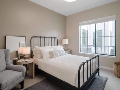 A well-furnished private resident room with natural light