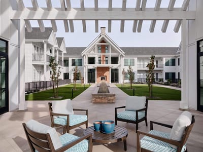 View of an outdoor courtyard with seating and landscaping