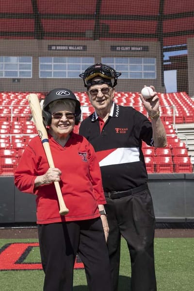 Seniors engaging in baseball-themed activity on the field