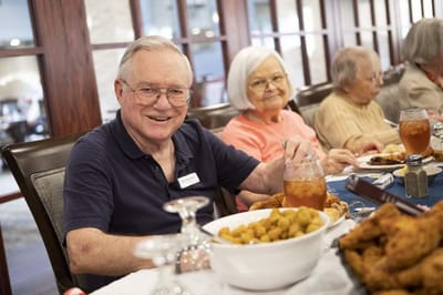 Residents enjoying a meal in the dining room