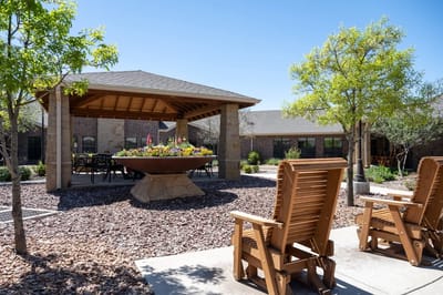 Outdoor seating area with gazebo and flower planters