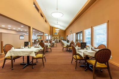 Dining room with tables set for meals