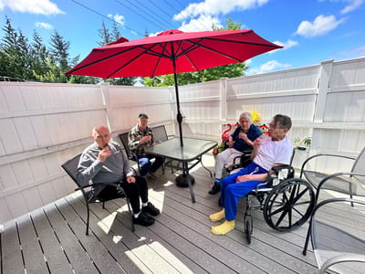 Residents enjoying refreshments on a patio