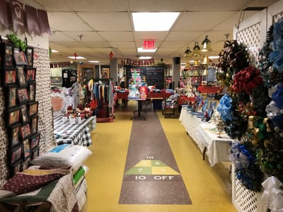 Common area filled with festive decorations and items for sale.