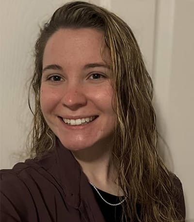 Smiling staff member in a casual setting