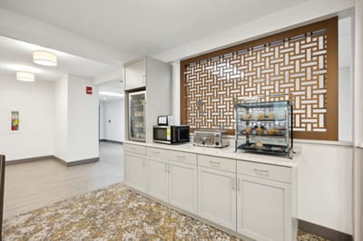 Common area with a snack station and seating.