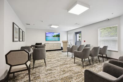 Interior common area with seating and a TV