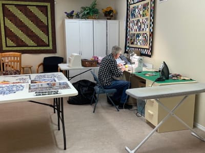 Resident engaging in a quilting activity.