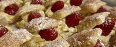 Delicious pastries filled with cream and raspberries.