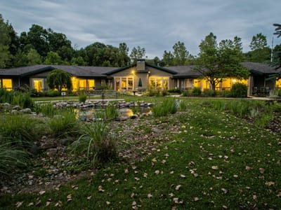 Exterior view of the facility with landscaped grounds.