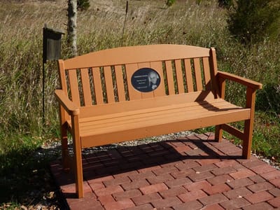A memorial bench in an outdoor area