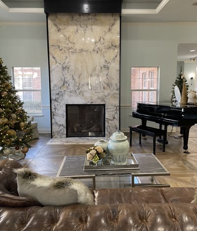 Cozy common area with fireplace and decorations.