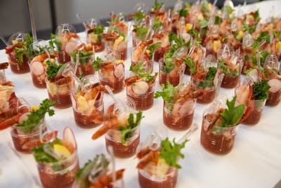 Plated shrimp cocktails with garnishes on display
