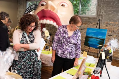 Residents engaged in an art event indoors.