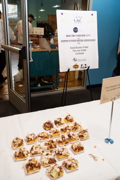 Catering display with pulled pork over cornbread