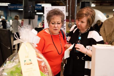 Two women engaged in conversation at an event