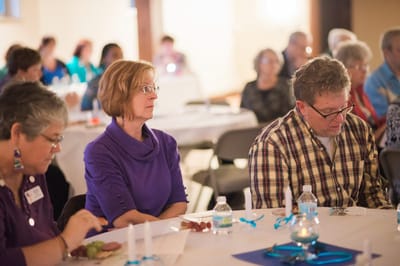 Residents attending an event in a common area.