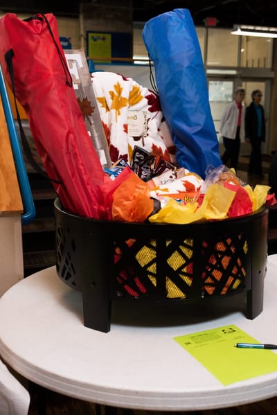 A basket filled with colorful items and gifts.