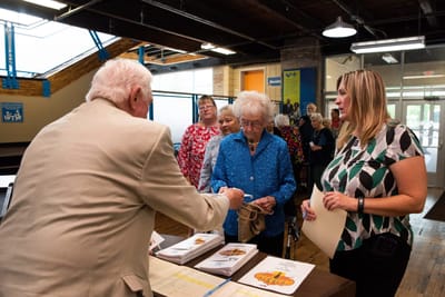 Residents engaging with staff during an event