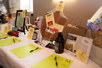 Event display table with items and bid sheets.