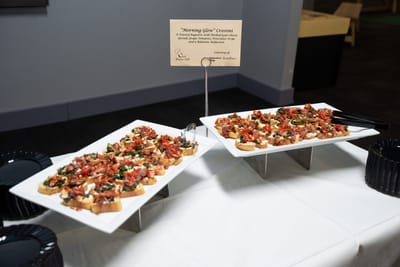 Gourmet crostini appetizers displayed at an event.