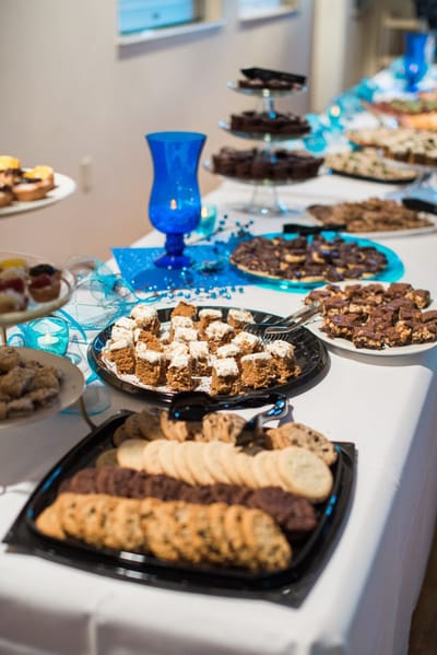 A table filled with assorted desserts and pastries.
