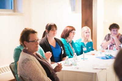 Staff members engaged in a meeting at the facility