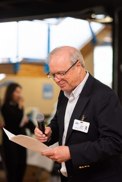 Resident speaking at a community event.