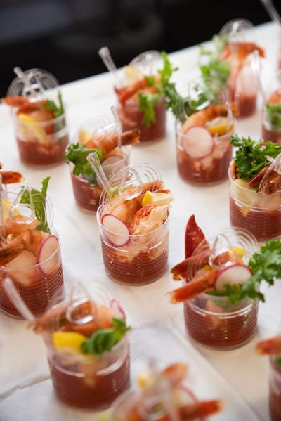 Plated seafood appetizers arranged for an event.