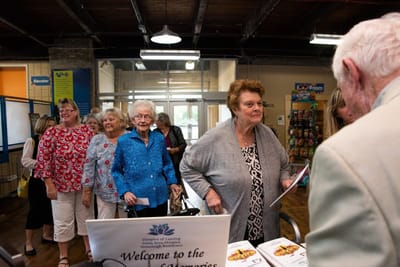 Residents participating in a community event indoors.