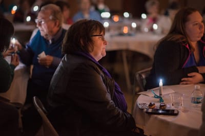 Residents engaging in a candlelight activity.