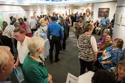 Residents and staff engaged in a lively event