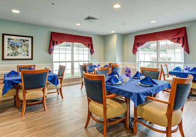 Dining room with tables set for residents