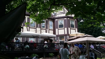 Exterior view of the facility with residents socializing outdoors
