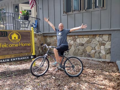 Resident enjoying a bike ride near the entrance