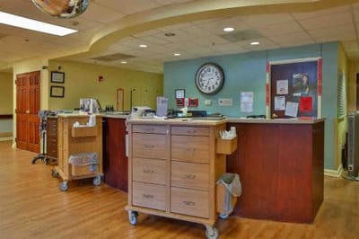 Interior view of a nursing station with a large clock