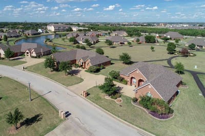 Aerial view of a senior living community with houses and landscaping