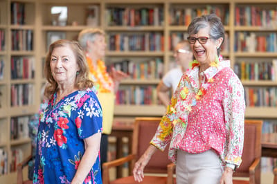 Residents enjoying a lively activity in the library