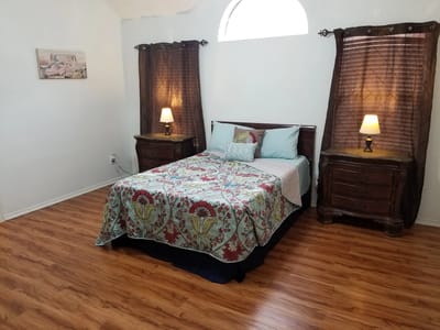 Cozy resident bedroom with decorative bedspread