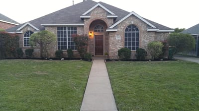 Exterior view of a single-story home with lawn