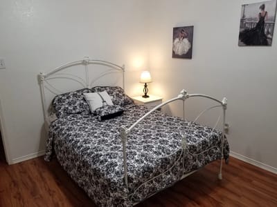 Cozy resident bedroom with floral bedding.