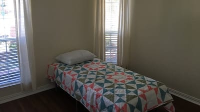 Private resident room with a bed and window