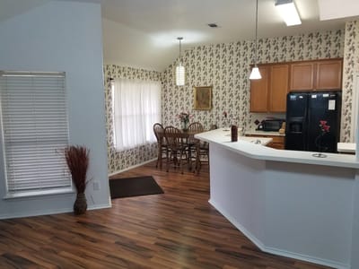 Bright interior space with dining area and kitchen