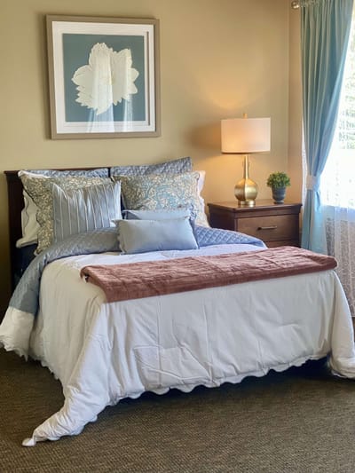Cozy resident bedroom with comfortable bedding