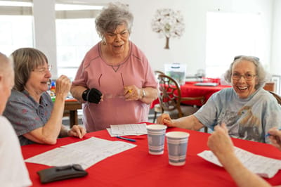 Residents engaged in an activity around a table