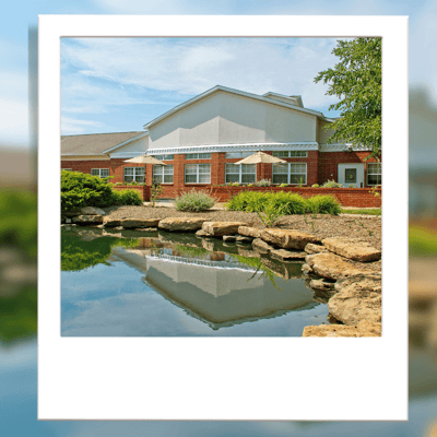 Exterior view of the facility by a pond