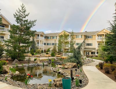 Beautiful outdoor garden with rainbow in the background