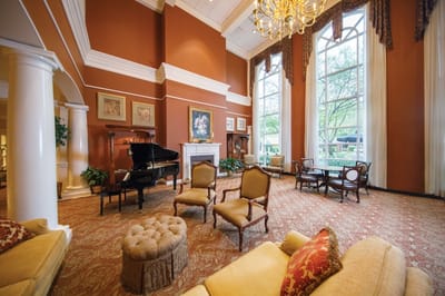 Elegant common area with seating and a piano
